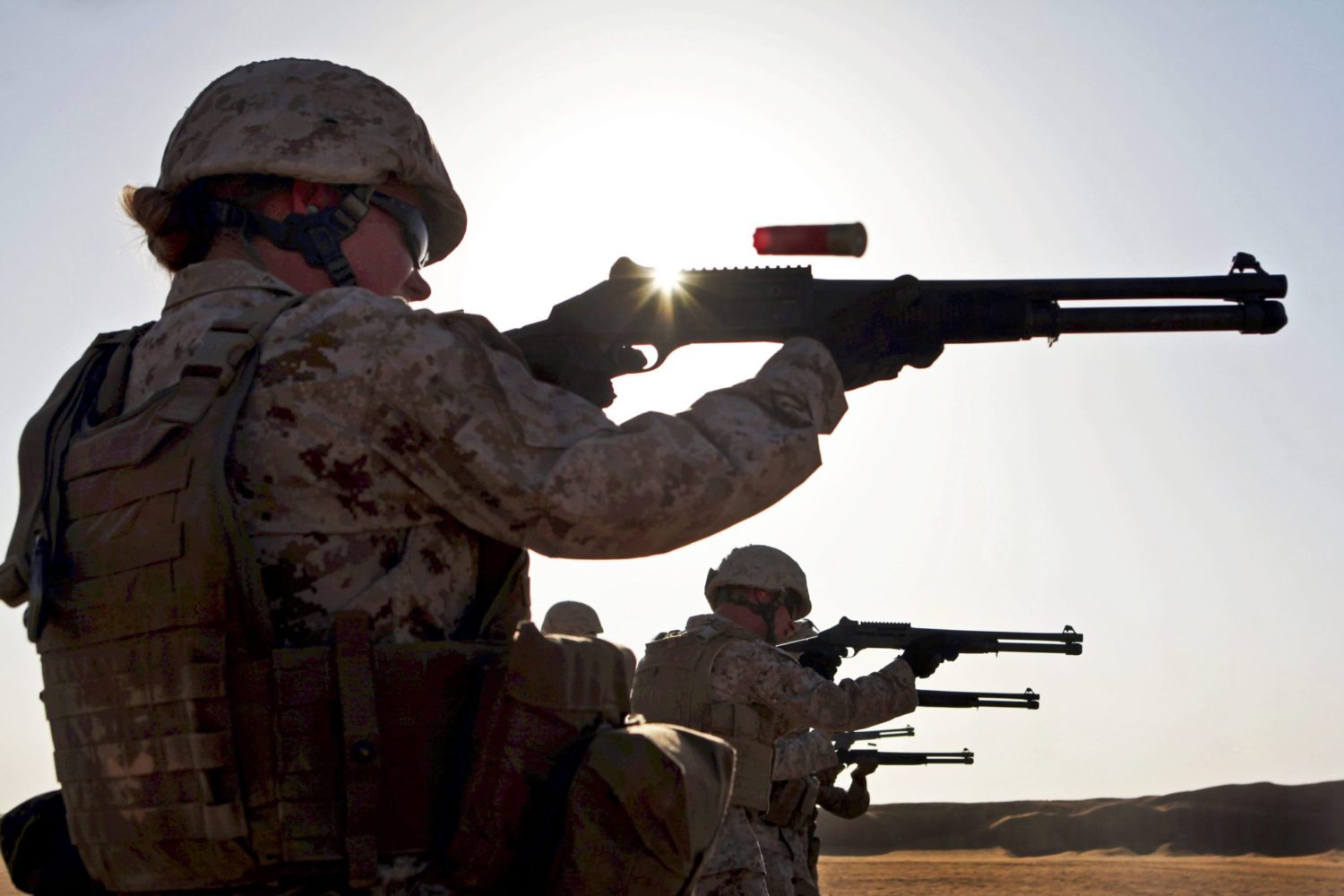 Sgt. Regina Smith, the radio supervisor and Sherevport, La., native with Combat Logistics Battalion 24, 24th Marine Expeditionary Unit, fires an M1014 shotgun during a shotgun range, Aug. 14, 2012, on Udairi Range, Kuwait. The Marines are in Kuwait as part of a 24th MEU sustainment training package. The 24th MEU is deployed with the Iwo Jima Amphibious Ready Group as a U.S. Central Command theater reserve force providing support for maritime security operations and theater security cooperation efforts in the U.S. 5th Fleet area of responsibility. (Official Marine Corps photo by Sgt. Richard Blumenstein)