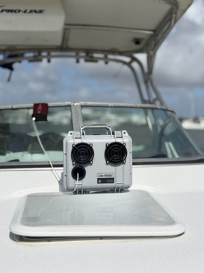 charging the demer box speaker on the boat